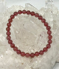 Natural strawberry quartz 6mm round gemstone bracelet with polished beads, crafted by World Wide Gems Minerals Beads.