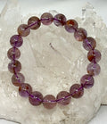 Natural Phantom Amethyst 10mm gemstone bracelet featuring polished purple amethyst beads from World Wide Gems Minerals Beads.