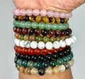 Set of 12 round 8mm bracelets from World Wide Gems Minerals Beads, featuring high-quality “A” grade gemstones in a colorful collection.