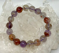 Natural Phantom Amethyst 12mm gemstone bracelet featuring polished purple quartz beads from World Wide Gems Minerals Beads.