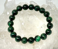 Natural emerald gemstone round bracelet with 10mm mica accents, featuring vibrant green beads from World Wide Gems Minerals Beads.