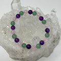 Set of three 8mm round gemstone bracelets featuring amethyst, green aventurine, and rose quartz from World Wide Gems Minerals Beads.
