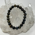Bumble Bee Tiger Eye 8MM round bracelet from World Wide Gems Minerals Beads featuring polished tiger eye stones.