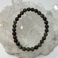 Copper Jasper 6mm round bracelet from World Wide Gems Minerals Beads, featuring polished copper jasper beads on a stretch cord.