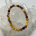 Set of three Mookaite 6mm round gemstone bracelets from World Wide Gems Minerals Beads, showcasing vibrant earthy tones.