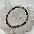 Pink Blossom Tourmaline 6mm round bracelet set by World Wide Gems, two-piece jewelry with vibrant pink gemstones.