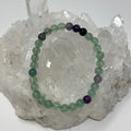 Rainbow Fluorite 6mm round gemstone bracelet by World Wide Gems Minerals Beads, featuring colorful fluorite beads.