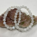 Rainbow Moonstone 7mm-8mm round bracelet set by World Wide Gems Minerals Beads, featuring two elegant gemstone bracelets.