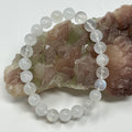 Rainbow Moonstone bracelet with 7mm-8mm round beads from World Wide Gems Minerals Beads, showcasing iridescent moonstone stones.