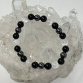 Set of three round Selenite Triple Protection bracelets with 8mm beads, featuring three mineral stones on each bracelet.