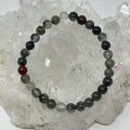 6mm Bloodstone round bracelet by World Wide Gems Minerals Beads featuring polished bloodstone beads on an elastic band.