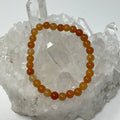 6mm red aventurine round bracelet from World Wide Gems Minerals Beads showing polished red aventurine beads strung together.