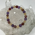 All-Star Quartz bracelet featuring strawberry quartz, citrine, and amethyst 8mm round beads by World Wide Gems Minerals Beads.