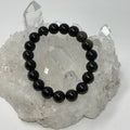 Black Golden Sheen Obsidian 10mm round bracelet with polished beads from World Wide Gems Minerals Beads.