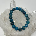 Blue Apatite 10mm round gemstone bracelet set by World Wide Gems, featuring two elegant beaded jewelry pieces.