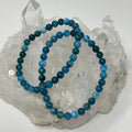 Blue Apatite 6mm round gemstone bracelet set by World Wide Gems Minerals Beads, featuring two matching bracelets.