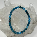Blue Apatite 6mm round bracelet featuring polished blue gemstone beads, crafted by World Wide Gems Minerals Beads.