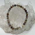 Botswana Agate 6mm round bracelet set by World Wide Gems with two matching gemstone bracelets in natural earth tones.