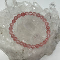Cherry Quartz 6mm round bracelet featuring polished cherry red quartz beads from World Wide Gems Minerals Beads.