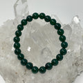 Three green agate 8mm round gemstone bracelets from World Wide Gems Minerals Beads, displayed together in a set.