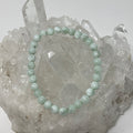 Green Angelite 6mm round bracelet featuring smooth beads from World Wide Gems Minerals Beads, showcasing vibrant green gemstone jewelry.