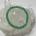 Green Aventurine 6mm round gemstone bracelet set with three elastic bracelets from World Wide Gems Minerals Beads, natural and polished.