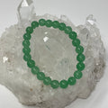 Green Aventurine 8mm round bracelet set with three bracelets from World Wide Gems Minerals Beads displayed on a neutral background.