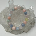 Morganite 10mm round bracelet featuring pink gemstone beads from World Wide Gems Minerals Beads, close-up view.