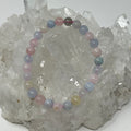 Morganite 6MM round gemstone bracelet by World Wide Gems Minerals Beads, featuring pink, faceted morganite beads on a delicate stretch cord.
