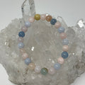 Set of two Morganite 8mm round gemstone bracelets by World Wide Gems Minerals Beads, featuring pink, faceted stones.