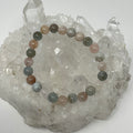 Multi-color aquamarine 8mm round gemstone bracelet set by World Wide Gems, featuring two elegant beaded bracelets.