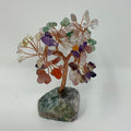 Multi-stone mineral tree sculpture with colorful gemstone branches and a wooden base from World Wide Gems Minerals Beads.