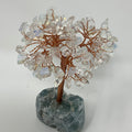 Opalite mineral tree sculpture with clear and iridescent stones, displayed on a wooden base, from World Wide Gems Minerals Beads.
