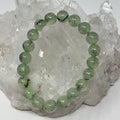 Prehnite 10mm round gemstone bracelet set with two pieces, from World Wide Gems Minerals Beads, featuring smooth, polished stones.