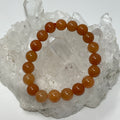 Red aventurine 10mm round bracelet set with three beaded stretch bracelets from World Wide Gems Minerals Beads.