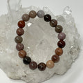 Red petrified wood 10mm round bracelet from World Wide Gems Minerals Beads, showcasing polished natural stone beads.