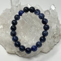 Sodalite 10mm round gemstone bracelet with three strands, crafted by World Wide Gems Minerals Beads, showcasing vibrant blue stones.
