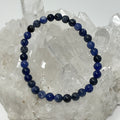 Sodalite 6mm round bracelet by World Wide Gems Minerals Beads featuring polished blue sodalite beads on elastic string.