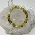 Yellow opal round bracelet featuring 7mm-8mm beads from World Wide Gems Minerals Beads, showcasing vibrant yellow gemstone jewelry.