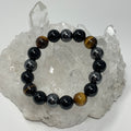 Yellow Tiger Eye triple protection 12mm round bracelet featuring three mineral beads on a stylish elastic band.