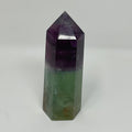 Natural fluorite mineral point from World Wide Gems Minerals Beads, showcasing vibrant green and purple crystal formations.