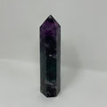 Vibrant green and purple fluorite mineral point from World Wide Gems Minerals Beads, showcasing its natural crystalline structure.