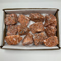Orange Calcite 12-piece mineral rock set from WorldWideMinerals-beads, showcasing vibrant orange mineral specimens arranged together.