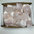 Set of 12 rose quartz mineral rocks from WorldWideMinerals-beads, showcasing pink quartz stones on a neutral background.